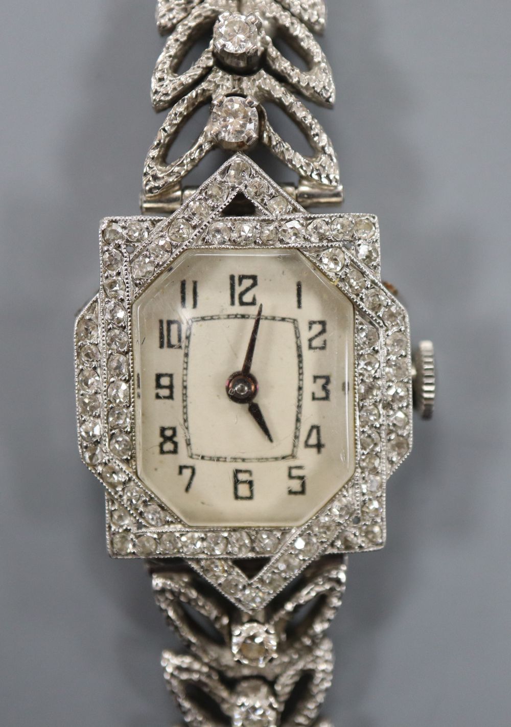 A ladys 18ct white gold and diamond set cocktail watch with diamond set bracelet, length 16cm, gross 33.3 grams.